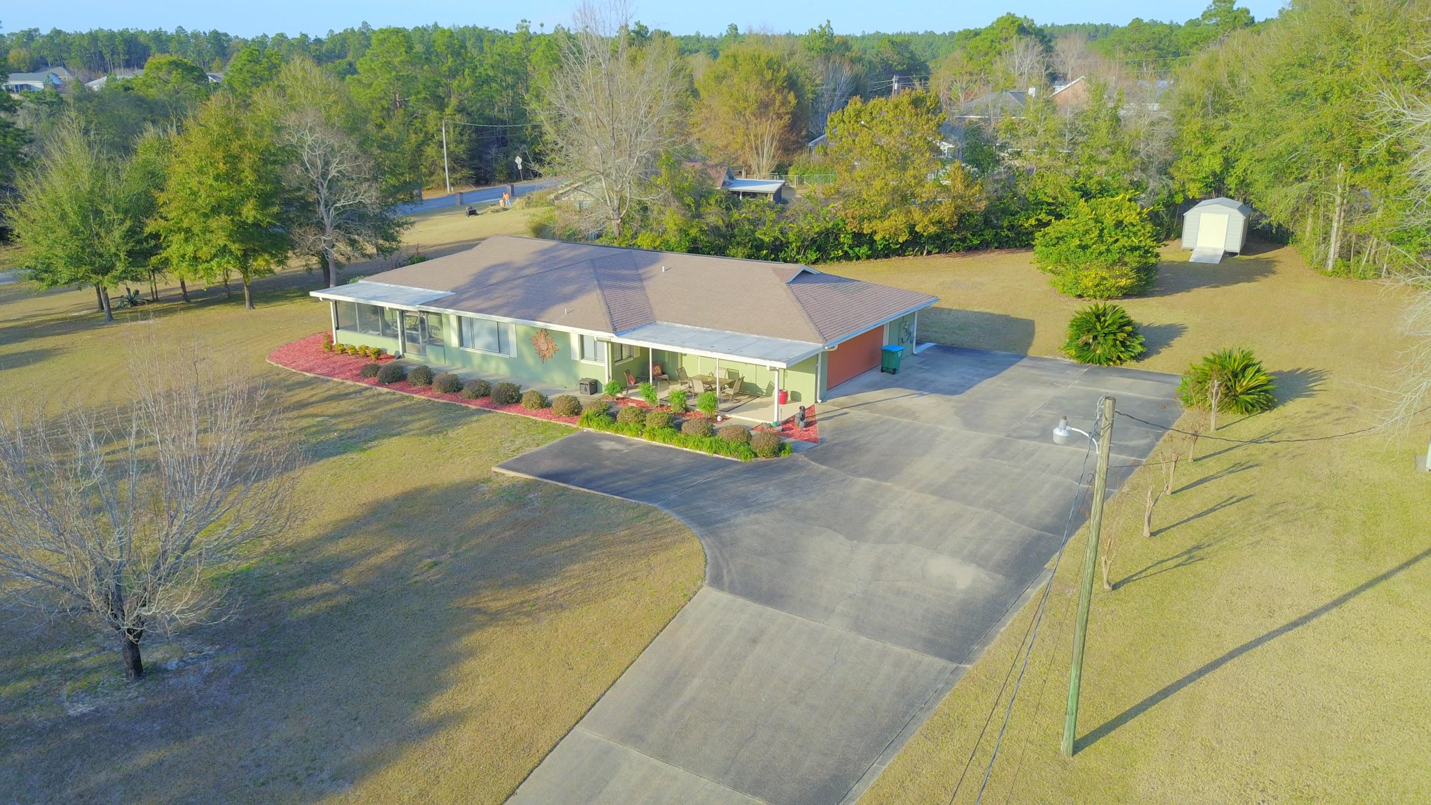 495 Ridge Lake Road Crestview, FL 32536 - Photo 1 of 26 a view of a houses with a yard