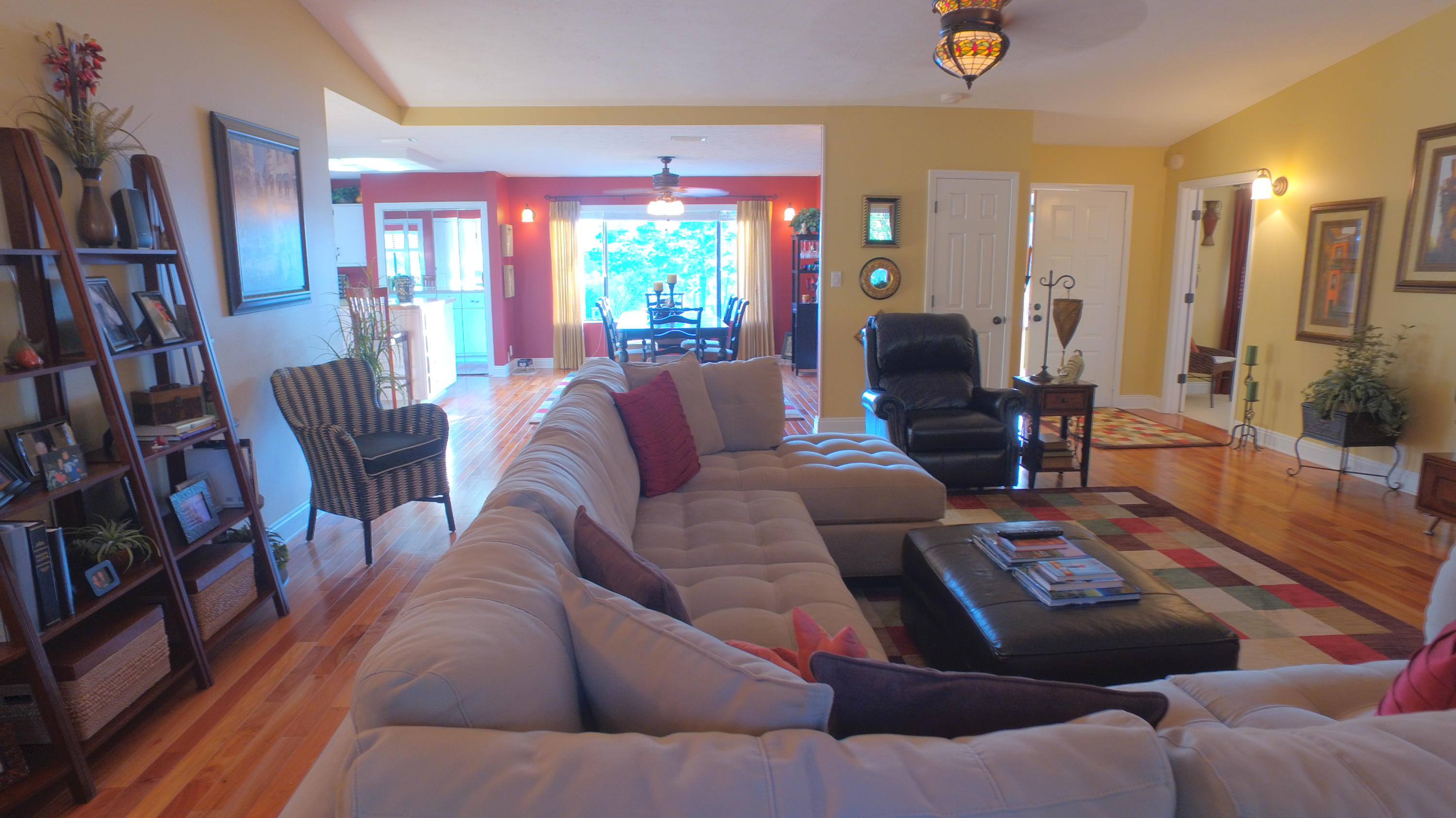 495 Ridge Lake Road Crestview, FL 32536 - Photo 11 of 26 a living room with furniture and a potted plant