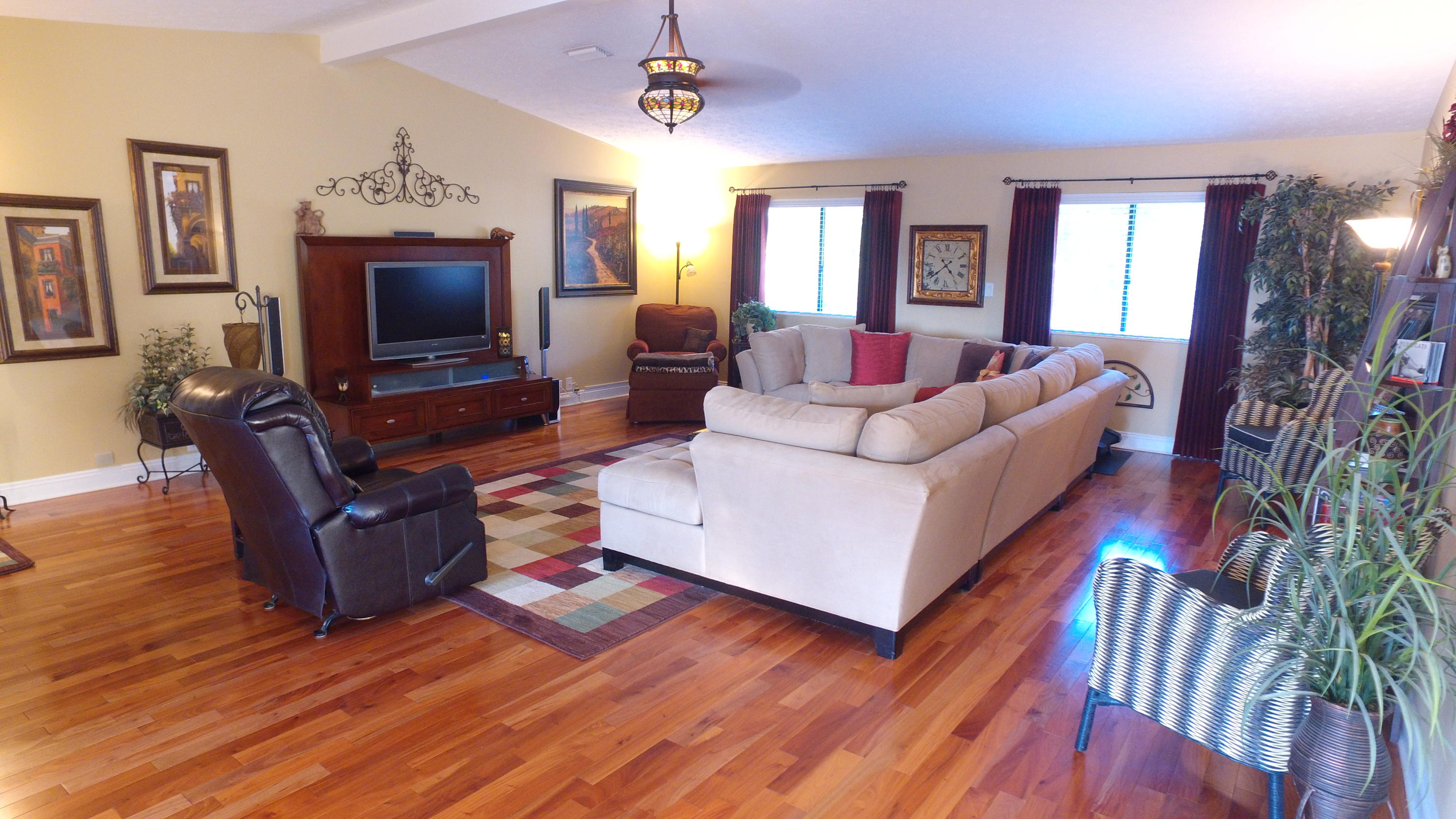 495 Ridge Lake Road Crestview, FL 32536 - Photo 13 of 26 a living room with furniture a flat screen tv and a fireplace