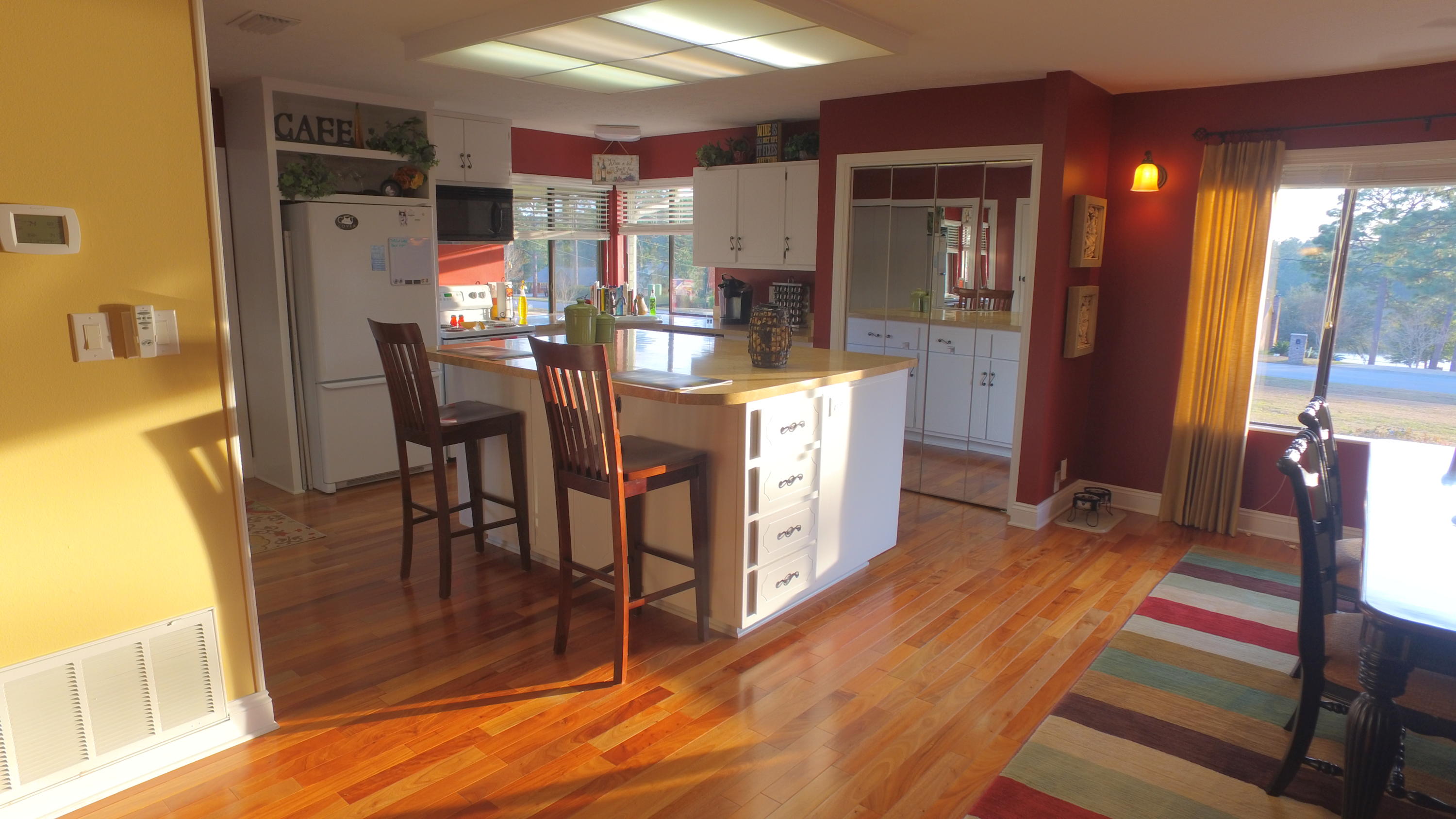 495 Ridge Lake Road Crestview, FL 32536 - Photo 14 of 26 a kitchen with stainless steel appliances granite countertop a refrigerator and a dining table