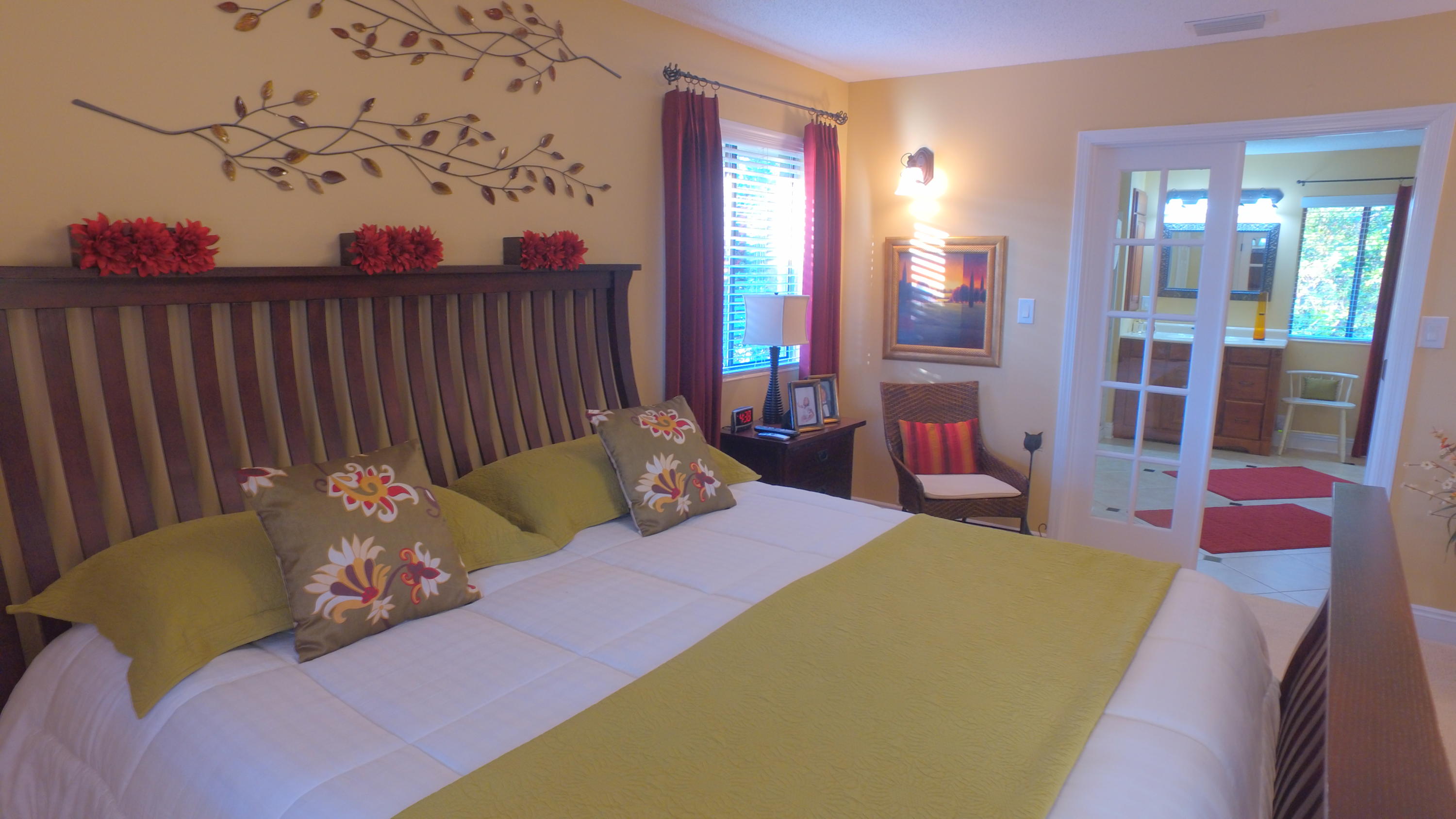 495 Ridge Lake Road Crestview, FL 32536 - Photo 18 of 26 a bedroom with a bed and a painting on the wall