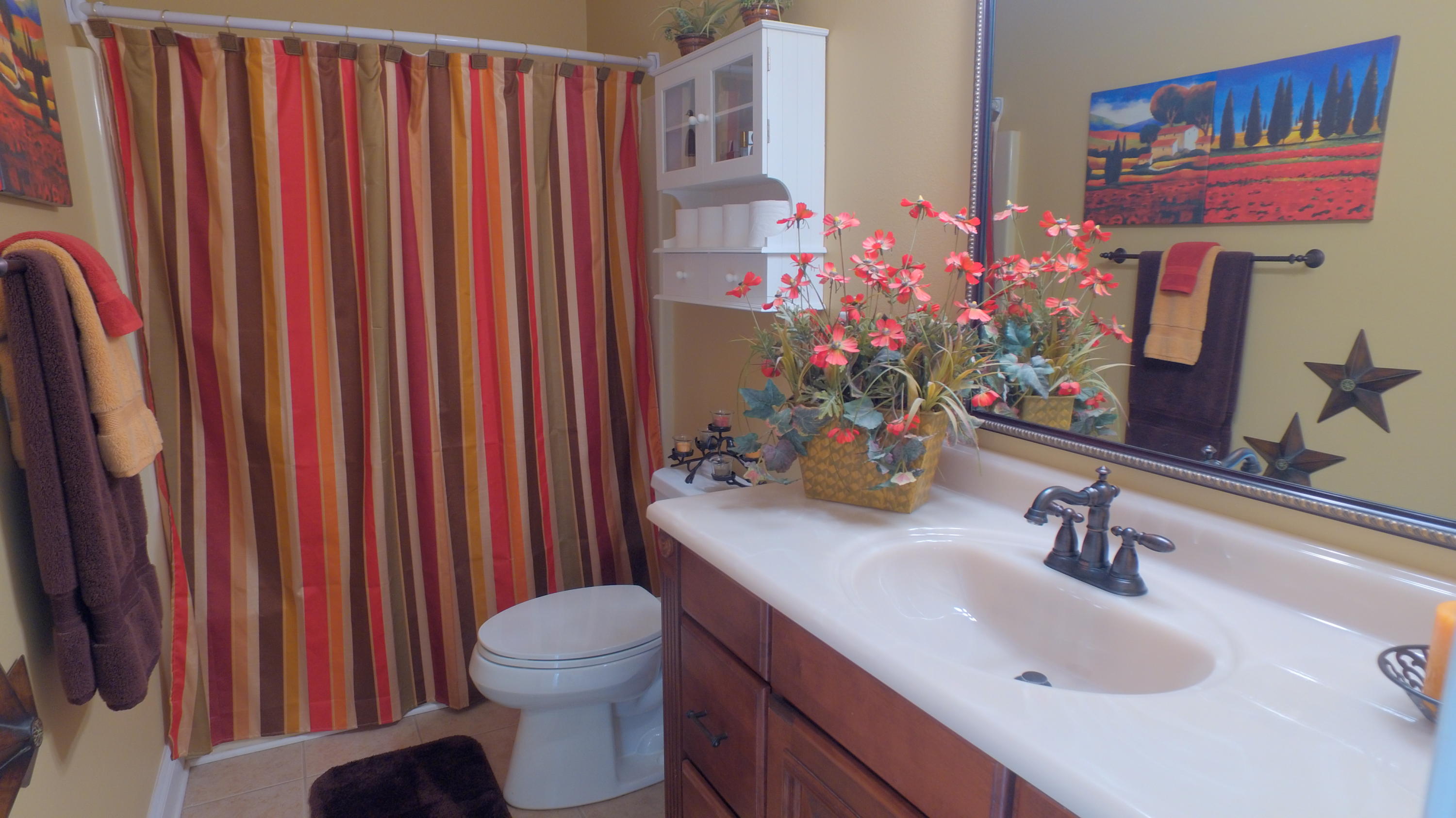 495 Ridge Lake Road Crestview, FL 32536 - Photo 24 of 26 a bathroom with a sink vanity mirror and toilet