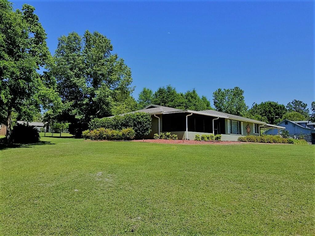 495 Ridge Lake Road Crestview, FL 32536 - Photo 5 of 26 a front view of a house with a yard