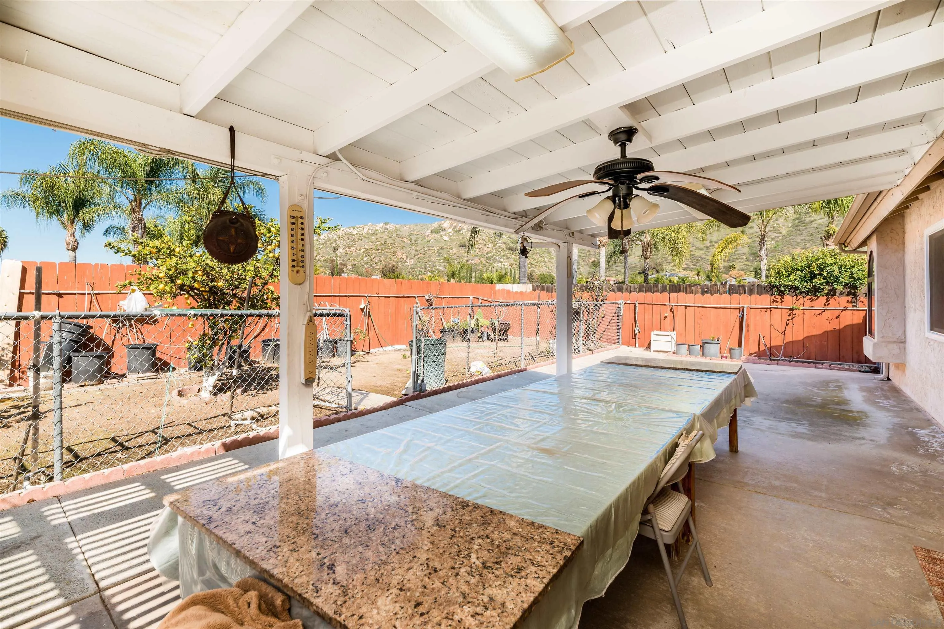 12810 Cochera Road Lakeside, CA 92040 - Photo 16 of 19 a view of a patio with a table and chairs