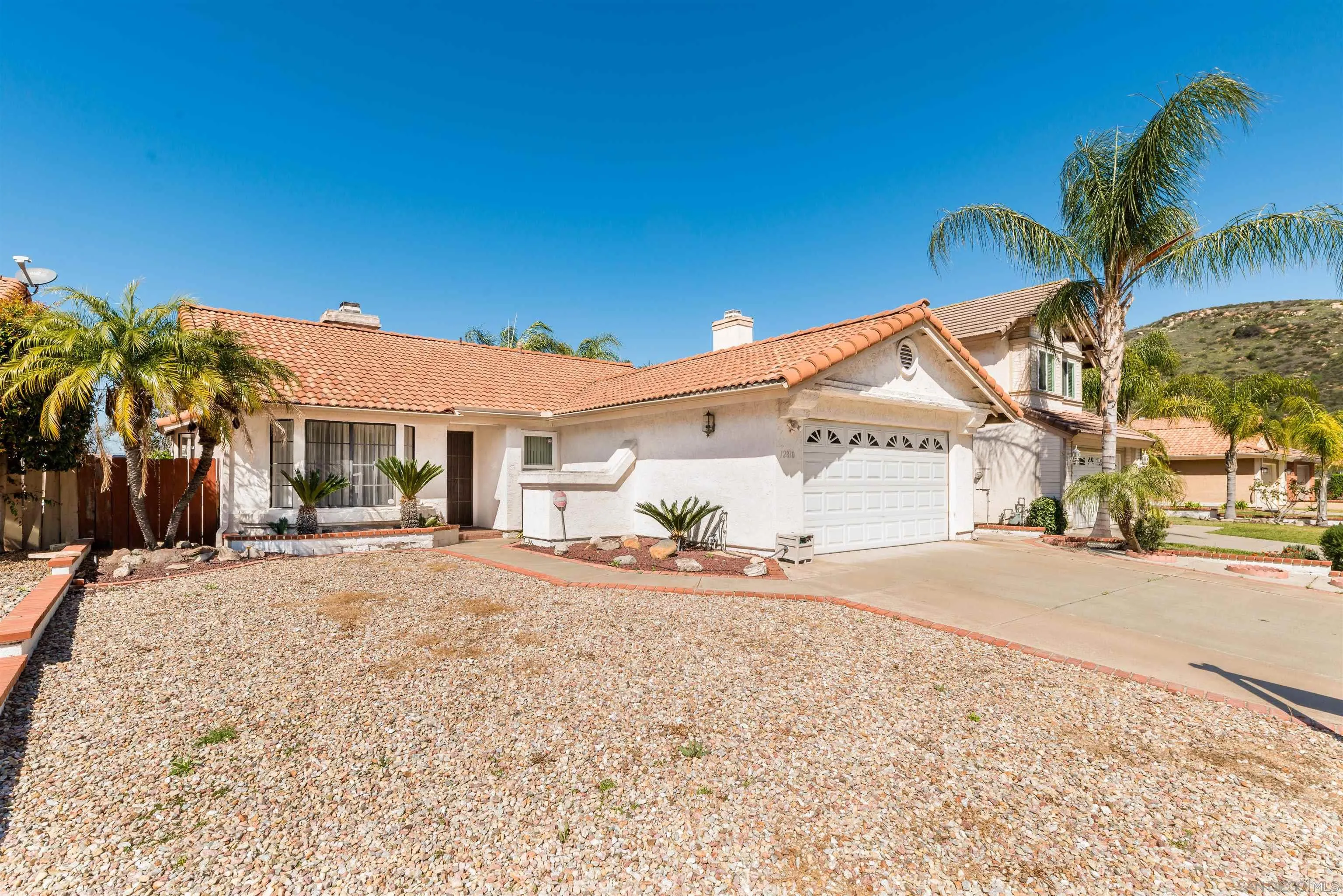 12810 Cochera Road Lakeside, CA 92040 - Photo 2 of 19 a view of a house with a patio