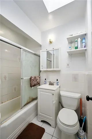 a bathroom with a toilet a sink and bathtub