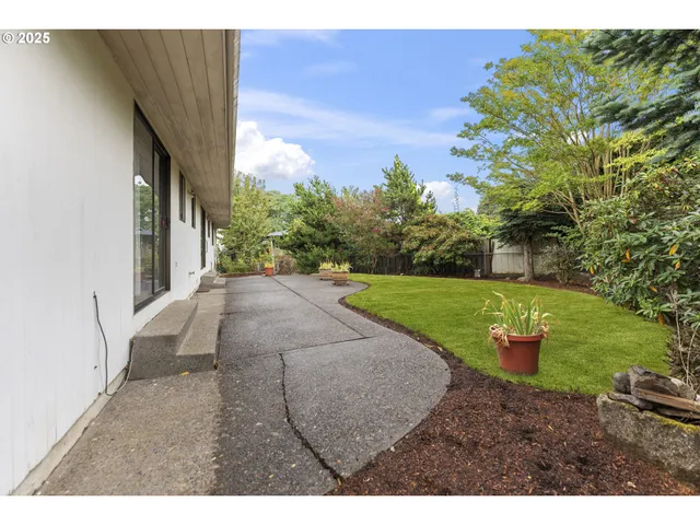 a view of a backyard with garden