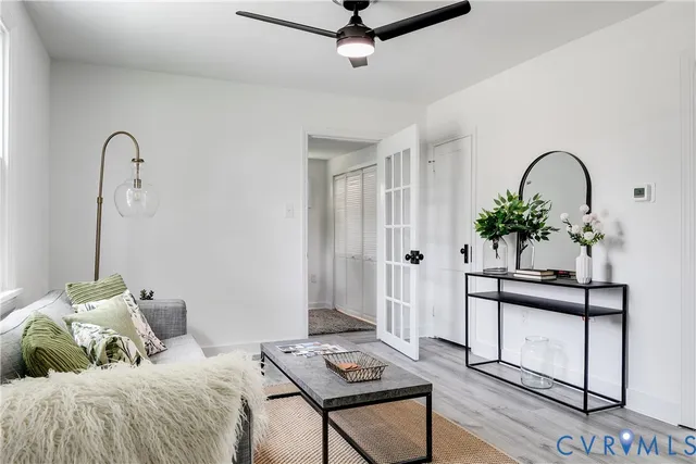 a bedroom with bed and a potted plant