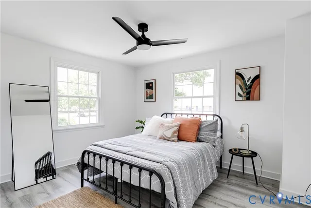 a view of a hallway with entryway and stairs