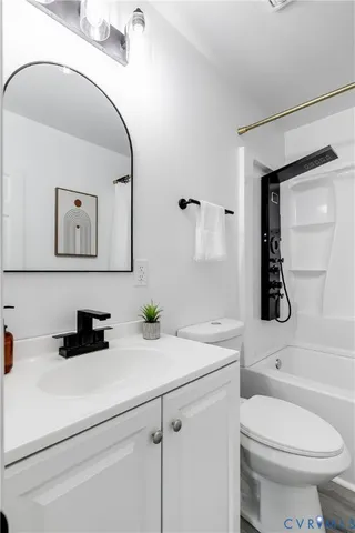 a backyard of house with wooden deck and furniture