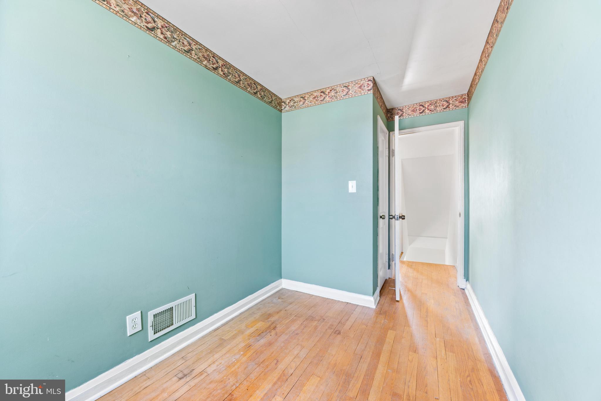 7310 Kirtley Road Baltimore, MD 21224 - Photo 24 of 31 a view of a hallway with wooden floor