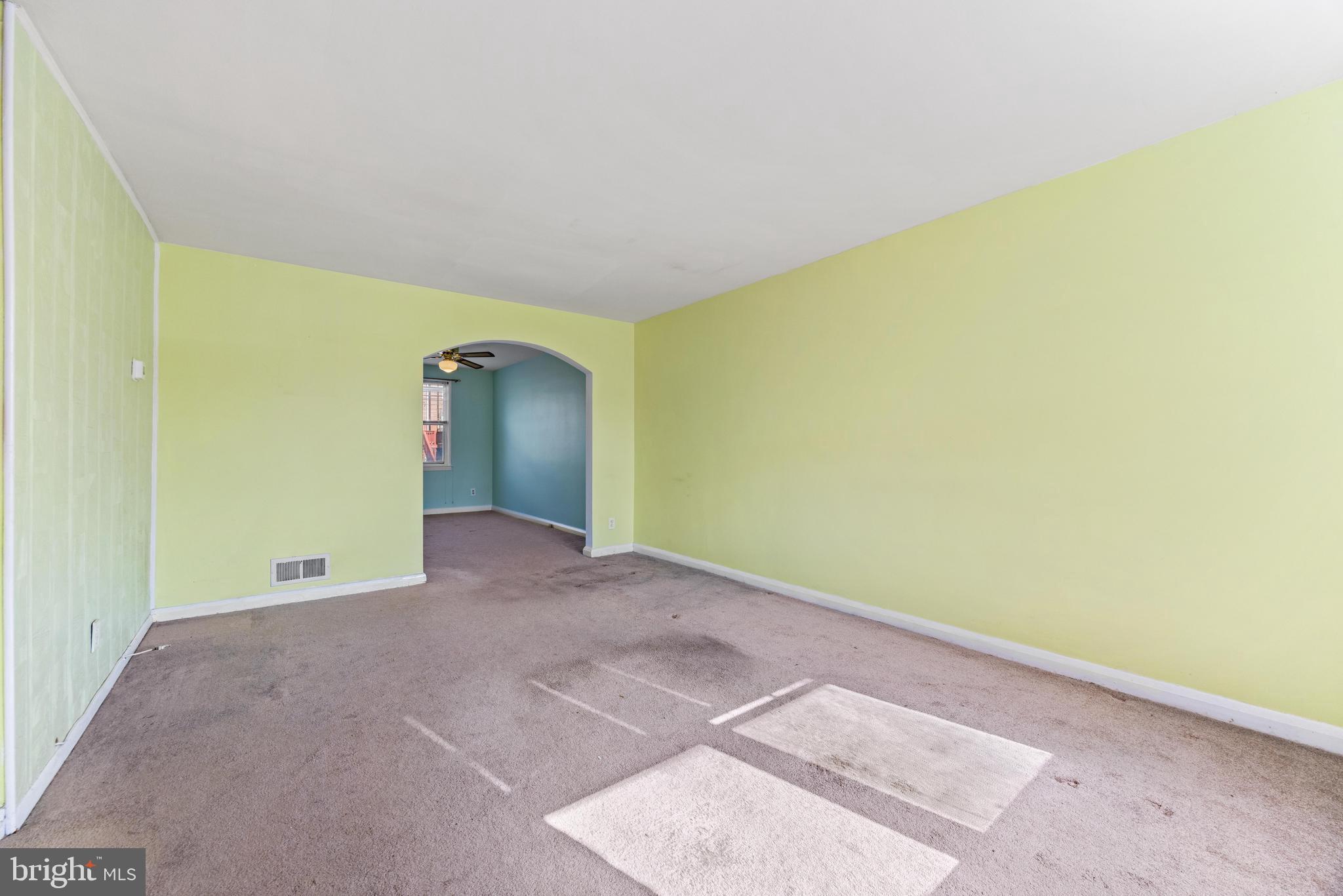 7310 Kirtley Road Baltimore, MD 21224 - Photo 3 of 31 a view of an empty room with a window