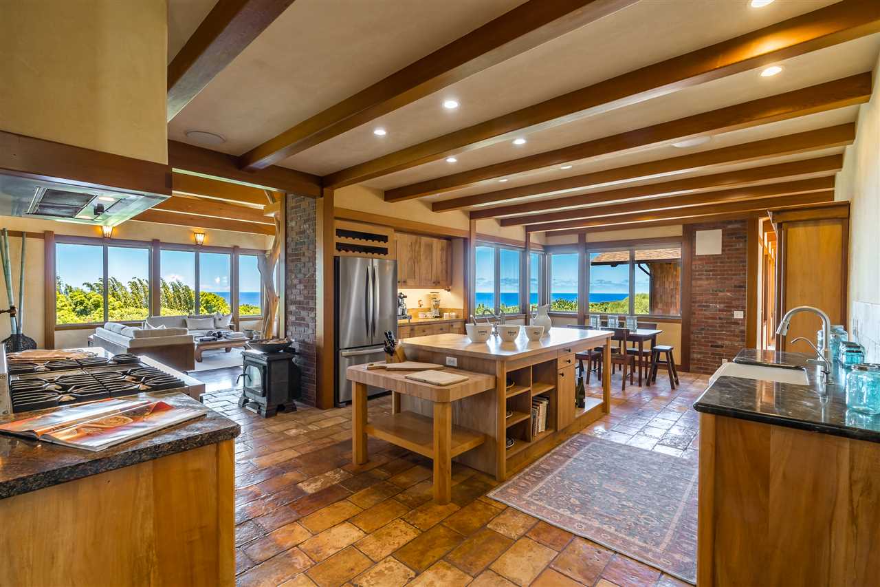 770 North Honokala Road, Unit A Haiku, HI 96708 - Photo 1 of 30 a large dining hall with stainless steel appliances granite countertop a stove and large window