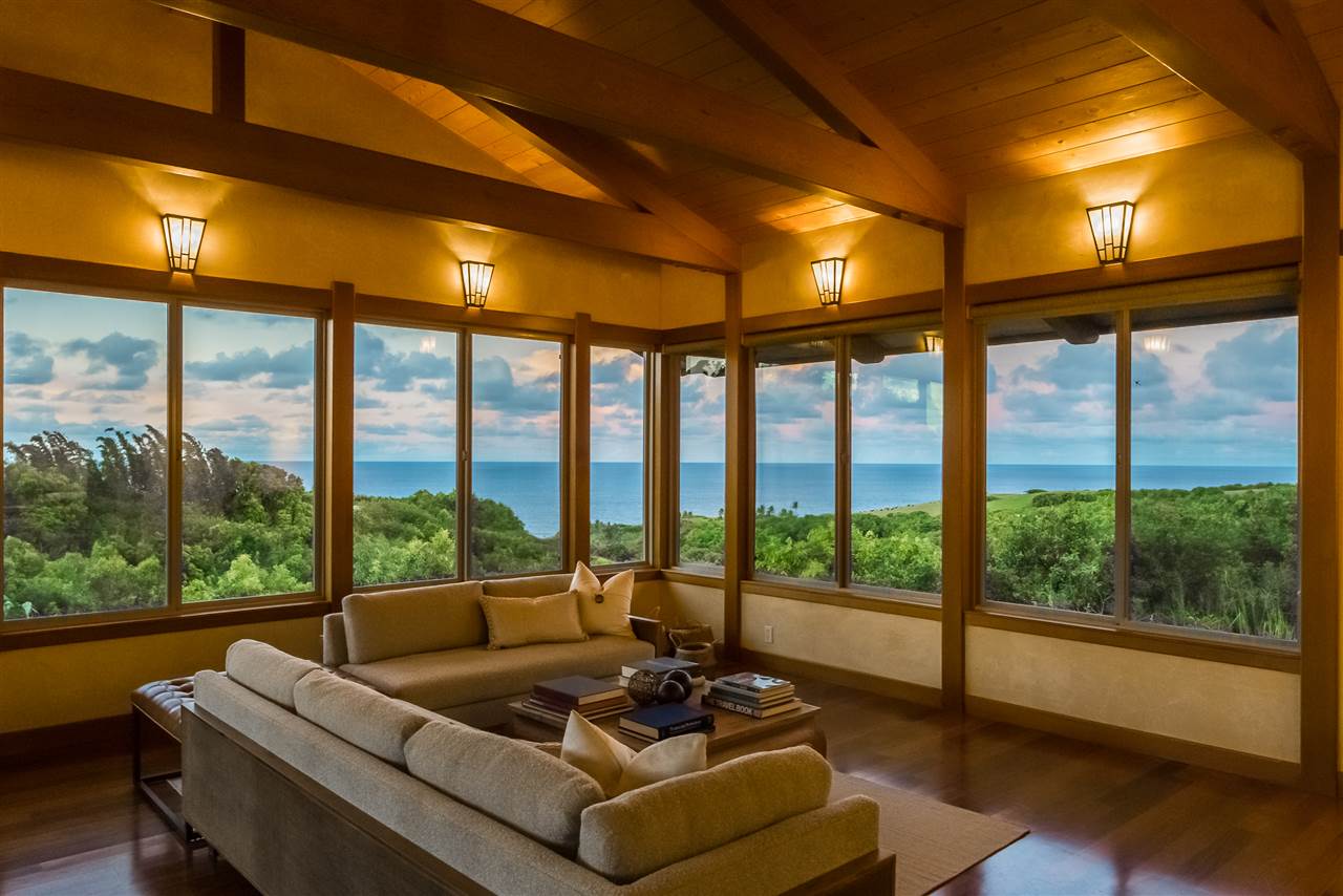 770 North Honokala Road, Unit A Haiku, HI 96708 - Photo 2 of 30 a living room with furniture and floor to ceiling windows