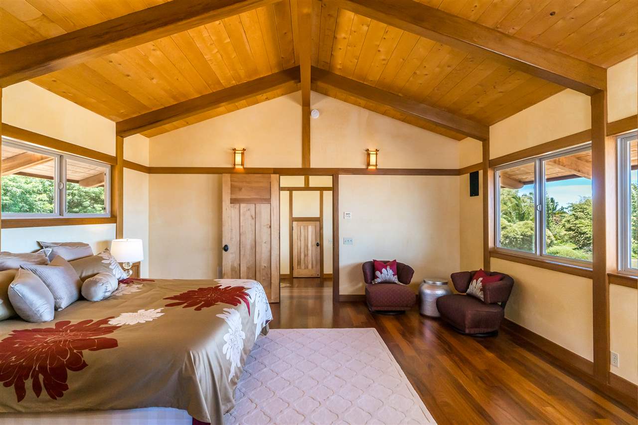 770 North Honokala Road, Unit A Haiku, HI 96708 - Photo 22 of 30 a bedroom with furniture and a large window