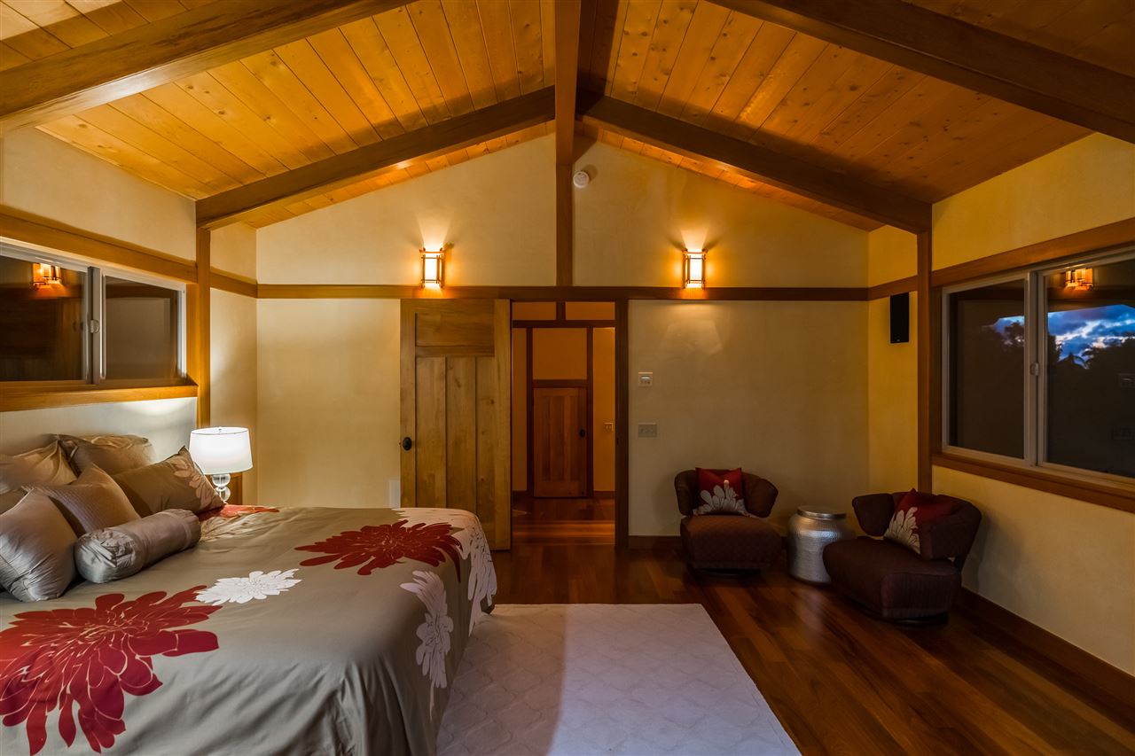 770 North Honokala Road, Unit A Haiku, HI 96708 - Photo 24 of 30 a bedroom with a bed and a walk in closet