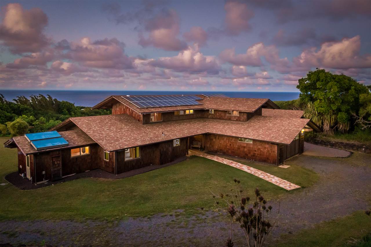 770 North Honokala Road, Unit A Haiku, HI 96708 - Photo 29 of 30 a view of a house with a yard and a tub