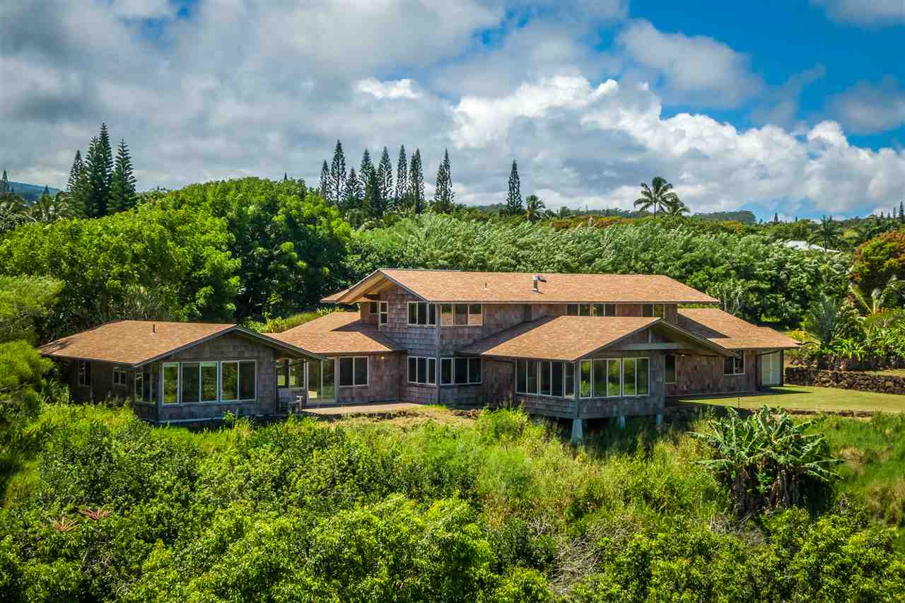 770 North Honokala Road, Unit A Haiku, HI 96708 - Photo 30 of 30 a front view of a house with yard and trees around