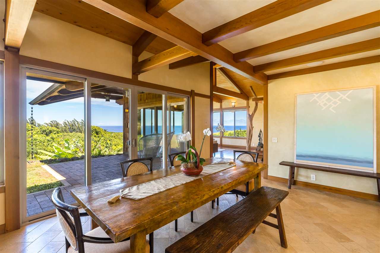 770 North Honokala Road, Unit A Haiku, HI 96708 - Photo 7 of 30 a dining room with furniture and wooden floor