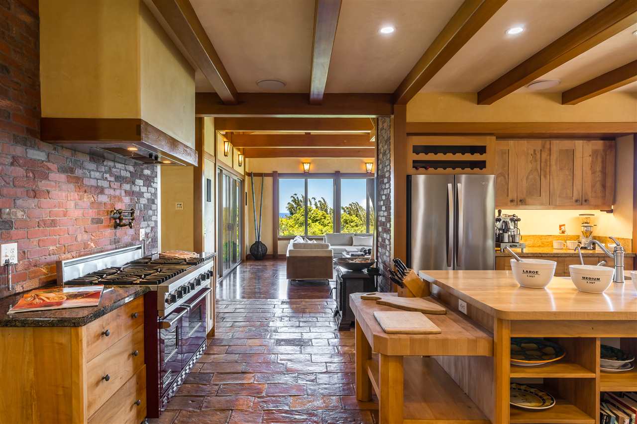 770 North Honokala Road, Unit A Haiku, HI 96708 - Photo 8 of 30 a kitchen with sink and stove