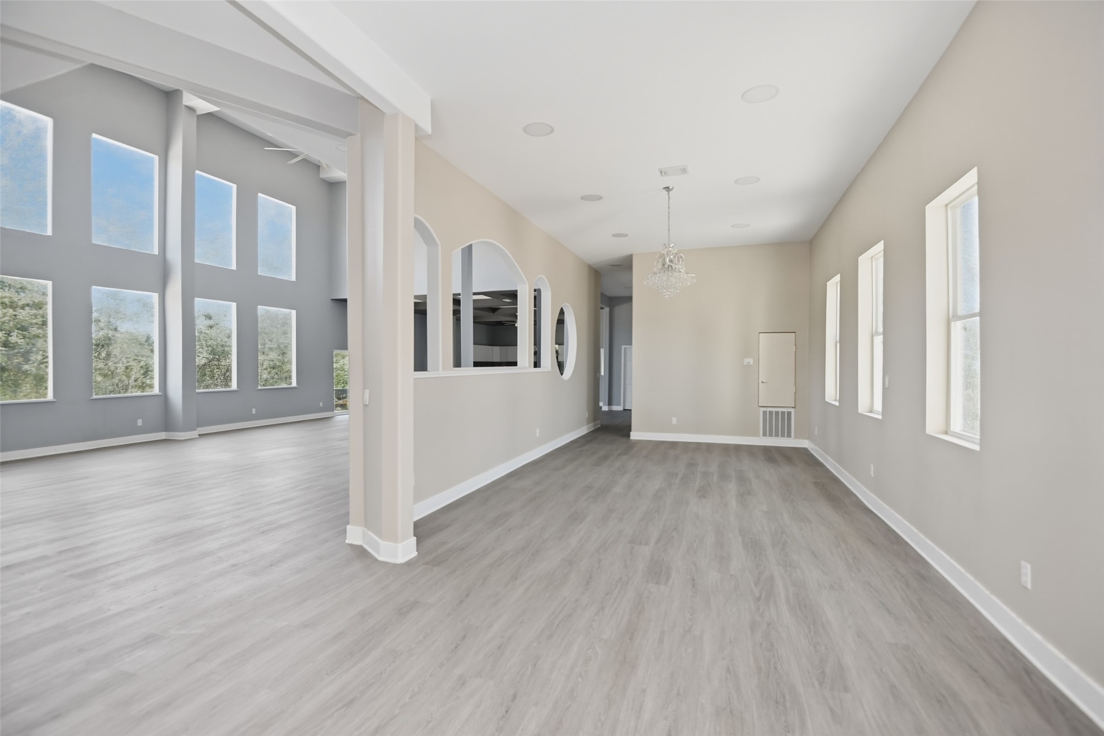 14300 Fallen Timber Drive Austin, TX 78734 - Photo 18 of 35 a view of a big room with wooden floor and windows