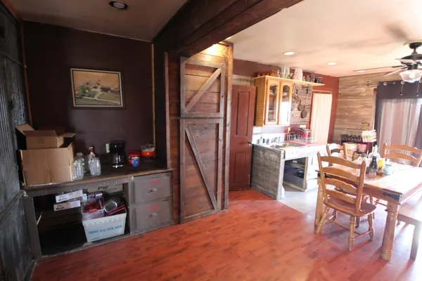 a room with furniture a flat screen tv and a table