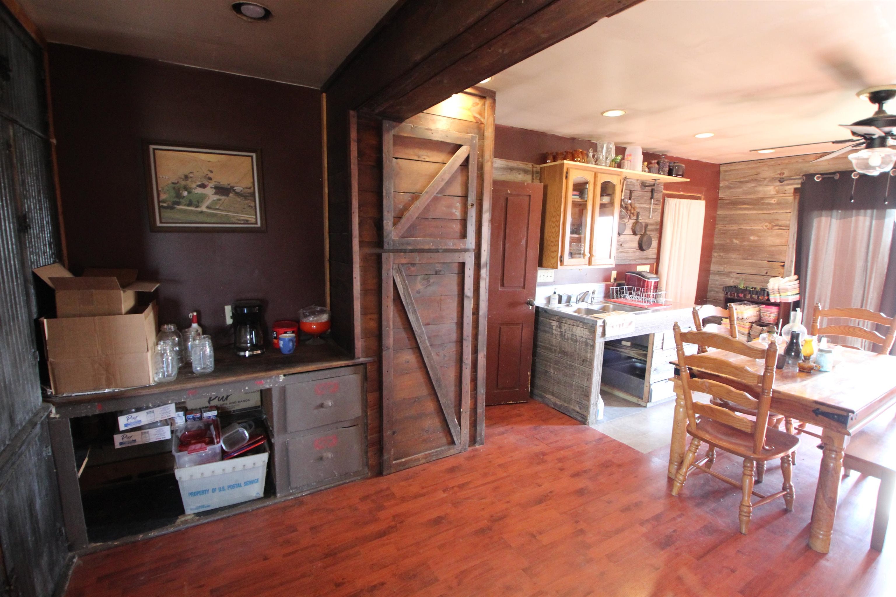 15210 Murphy Road Winnebago, IL 61088 - Photo 15 of 22 a room with furniture a flat screen tv and a table