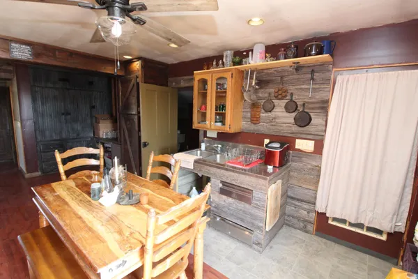 a living room with furniture a flat screen tv and a window