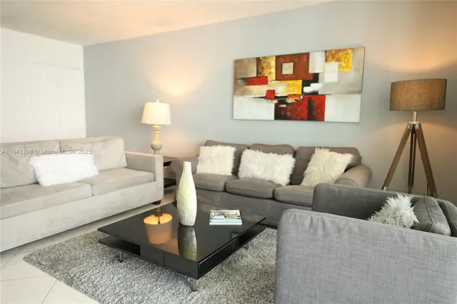 a living room with furniture and a couch