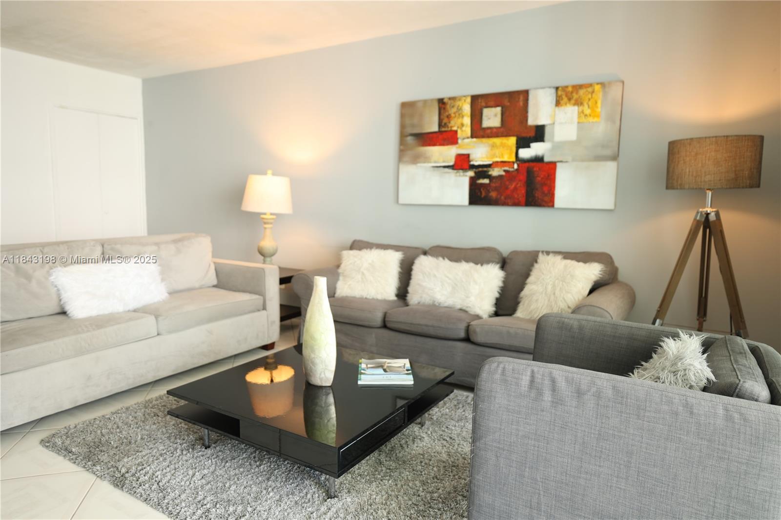 a living room with furniture and a couch