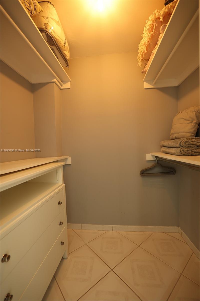 5151 Collins Avenue, Unit 927 Miami Beach, FL 33140 - Photo 11 of 19 a utility room with dryer and washer