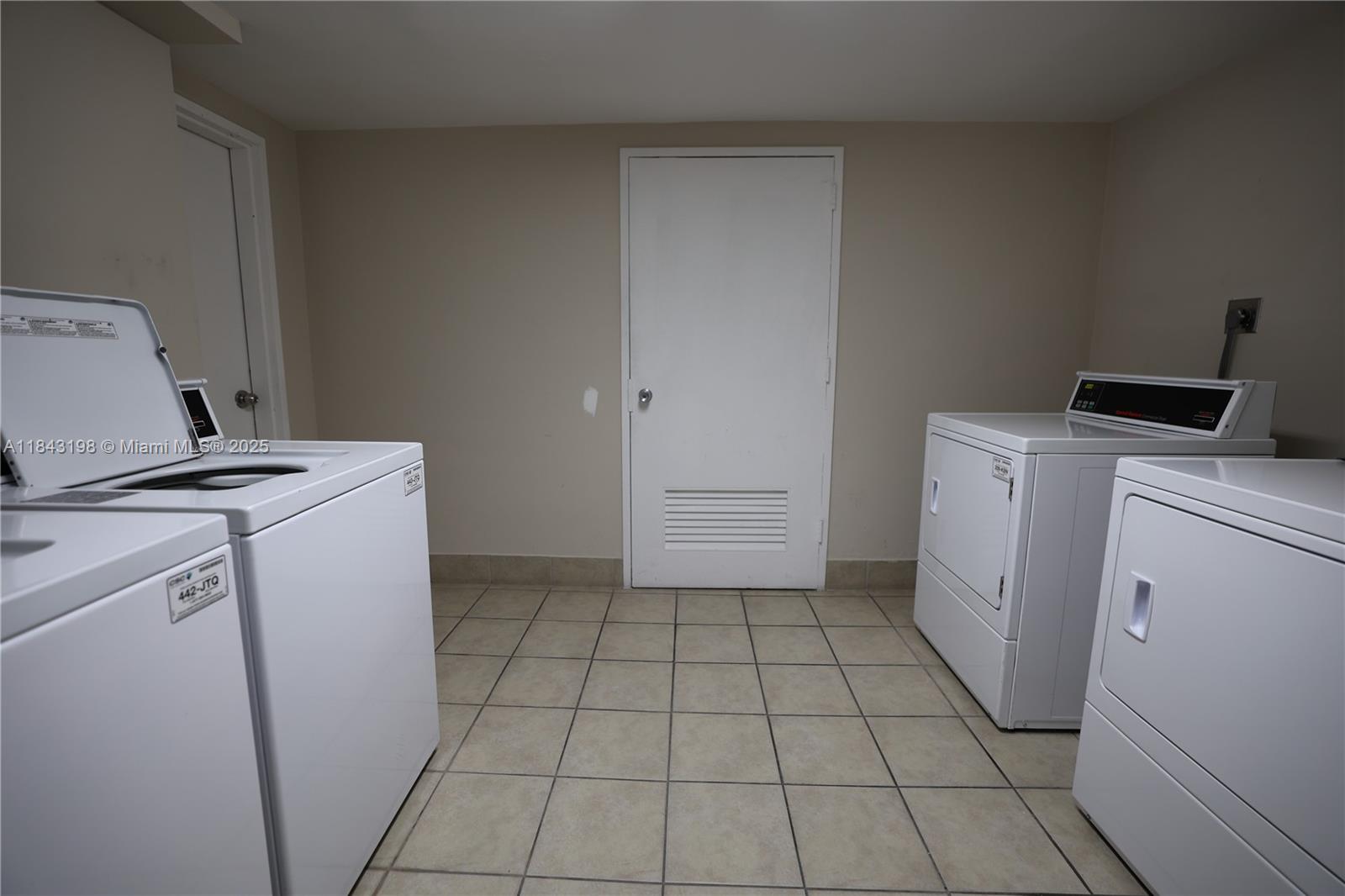5151 Collins Avenue, Unit 927 Miami Beach, FL 33140 - Photo 14 of 19 a utility room with dryer and washer