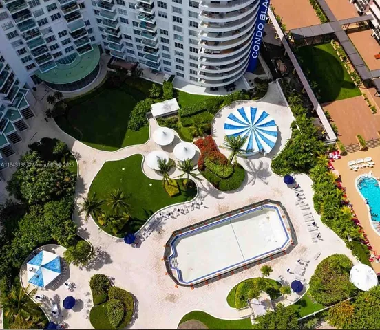 an aerial view of a swimming pool outdoor seating