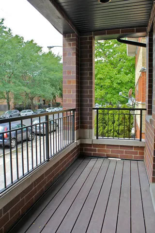 a view of balcony with wooden floor