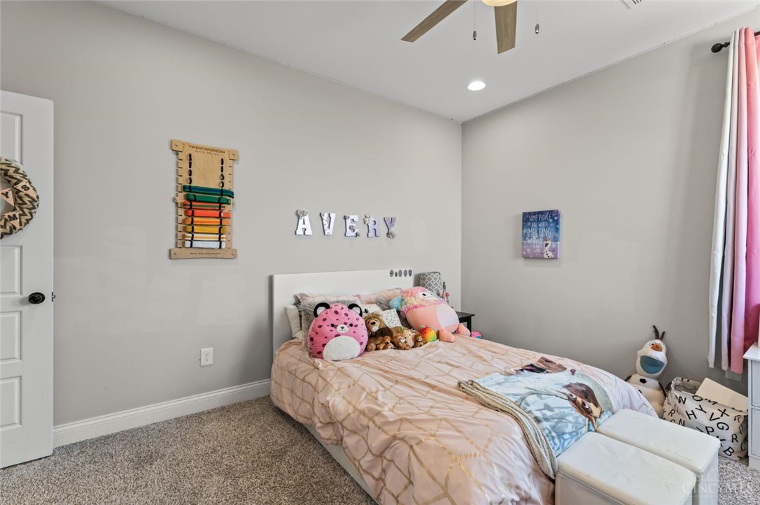 2425 Middleboro Road Clarksville, OH 45113 - Photo 85 of 91 This cozy bedroom features soft carpet and a convenient ceiling fan for ultimate comfort.