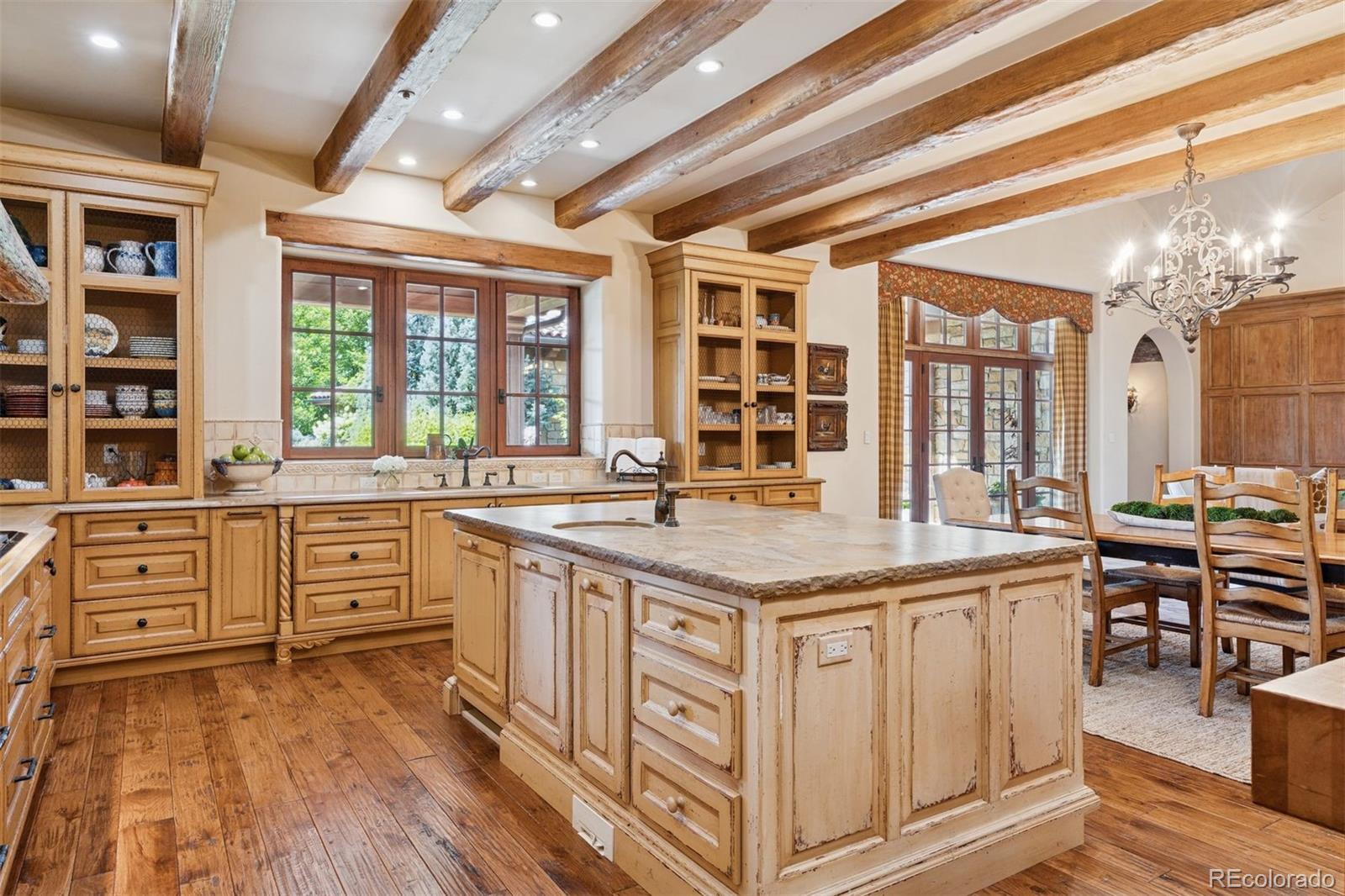 7 Village Road Cherry Hills Village, CO 80113 - Photo 18 of 50 a kitchen with stainless steel appliances granite countertop a stove and cabinets