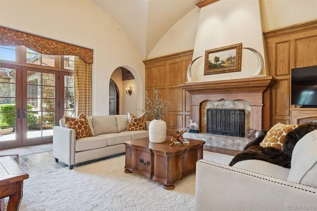 a living room with furniture fireplace and a flat screen tv