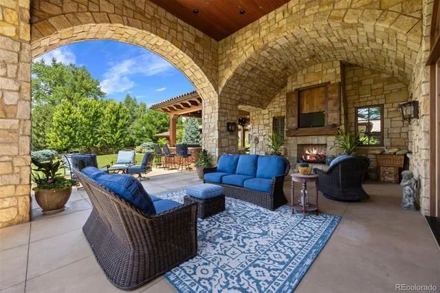 a view of a patio with couches and potted plants