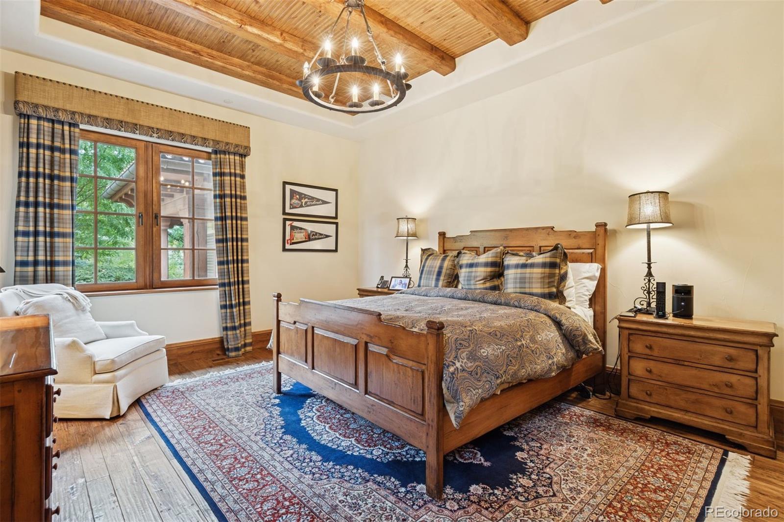 7 Village Road Cherry Hills Village, CO 80113 - Photo 34 of 50 a bedroom with a bed and wooden floor