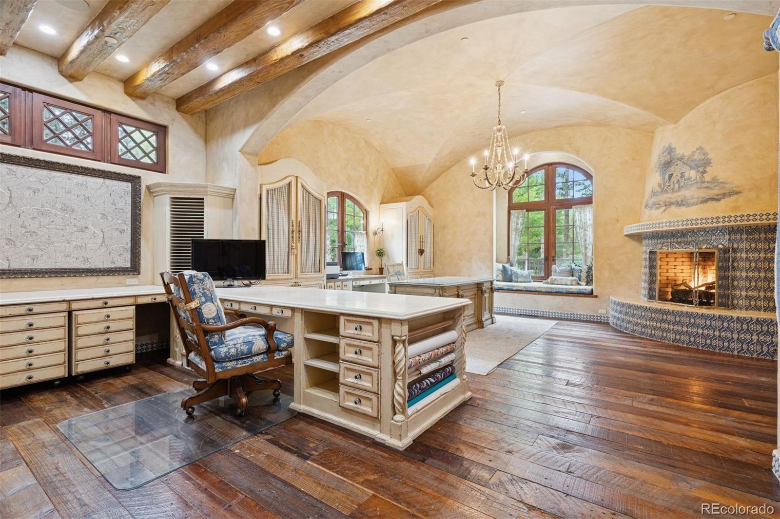 7 Village Road Cherry Hills Village, CO 80113 - Photo 35 of 50 a living room with furniture a fireplace and a chandelier