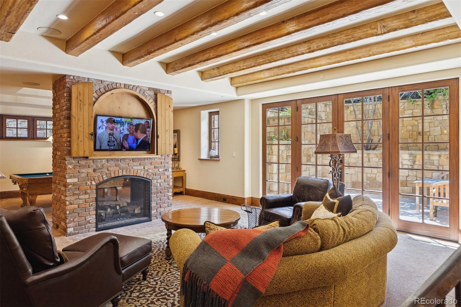 7 Village Road Cherry Hills Village, CO 80113 - Photo 37 of 50 a living room with furniture a fireplace and a potted plant