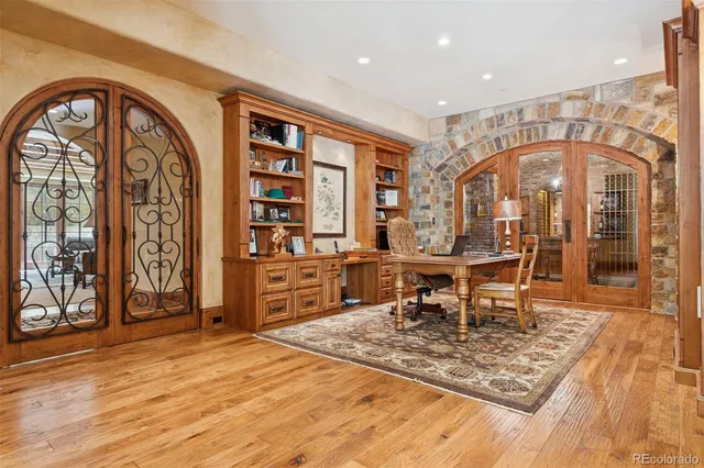 a view of a chair and table in backyard of the house