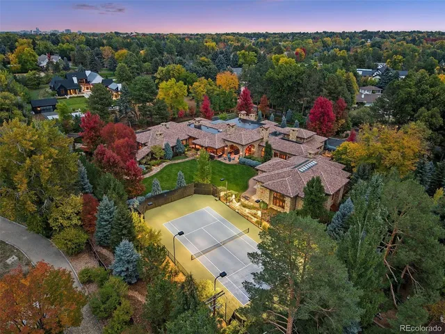 an aerial view of residential houses with outdoor space and street view
