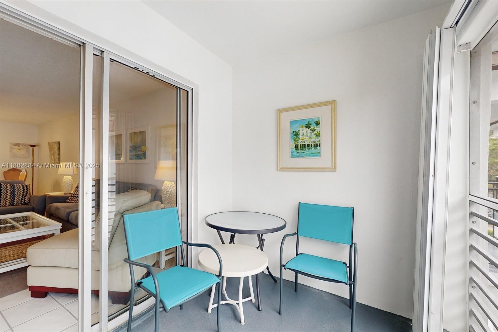 1501 South Ocean Boulevard, Unit 301 Lauderdale-by-the-Sea, FL 33062 - Photo 14 of 17 a view of a dining room with furniture and a window