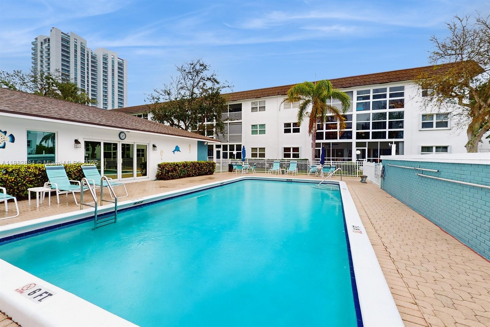 1501 South Ocean Boulevard, Unit 301 Lauderdale-by-the-Sea, FL 33062 - Photo 16 of 17 a swimming pool with outdoor view
