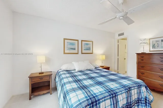 a bedroom with a bed and a table