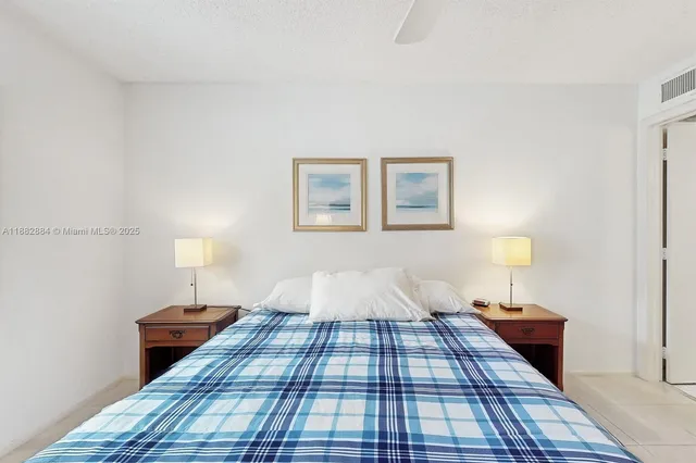 a bed room with a bed and a night stand