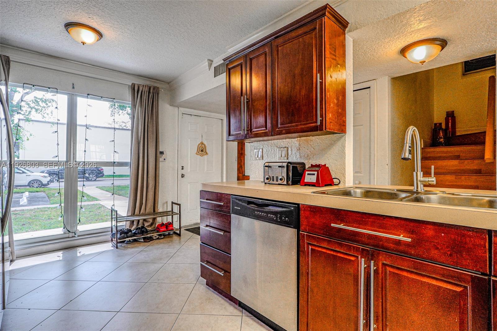 3331 Farragut Street, Unit 8A Hollywood, FL 33021 - Photo 1 of 26 a kitchen with a sink cabinets and appliances