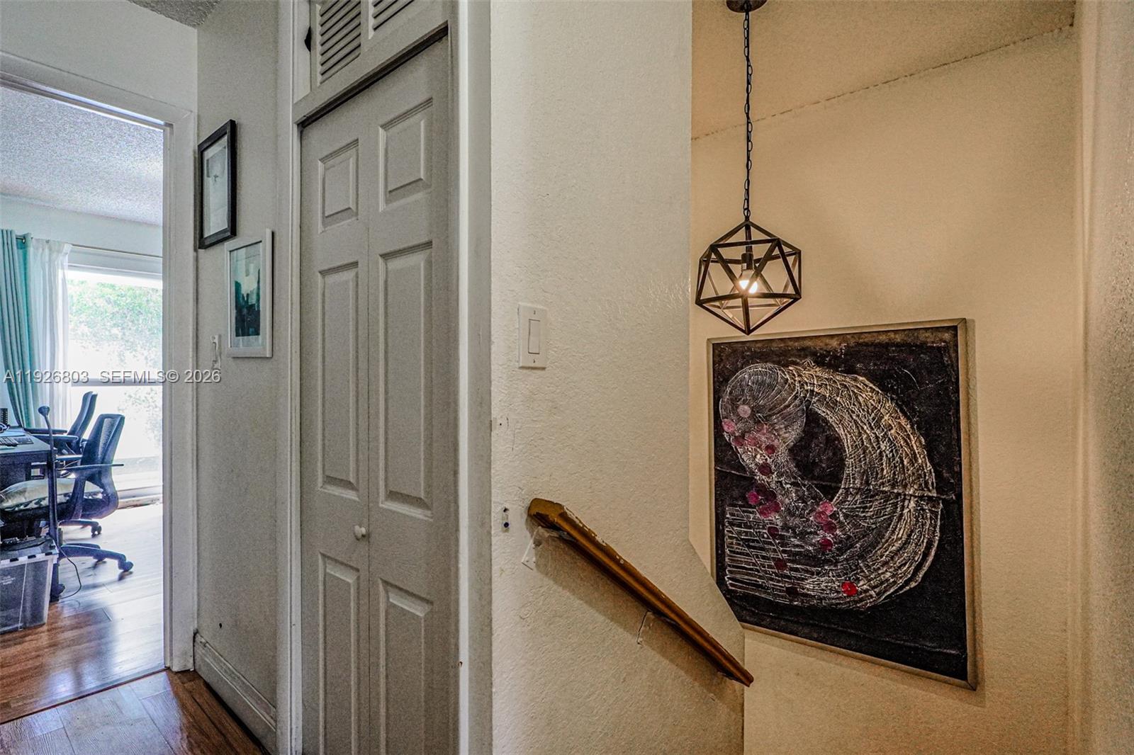 3331 Farragut Street, Unit 8A Hollywood, FL 33021 - Photo 12 of 26 a view of a hallway with paintings on the wall