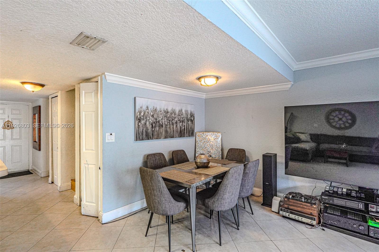 3331 Farragut Street, Unit 8A Hollywood, FL 33021 - Photo 15 of 26 a dining room with furniture and window